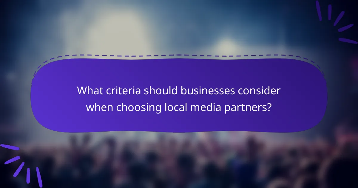 What criteria should businesses consider when choosing local media partners?